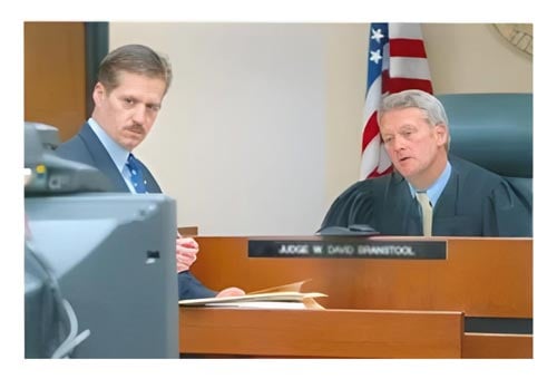 Robert E. Calesaric and judge in courtroom